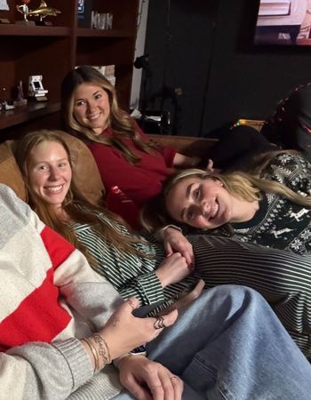 3 LeadVision employees smiling on the office couch