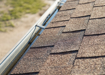 close up of gutters and roofing